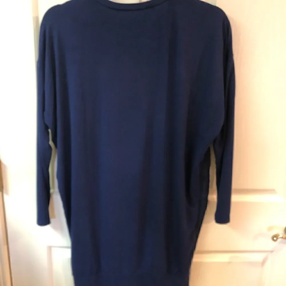 Guess tunic top, small snag line at the top